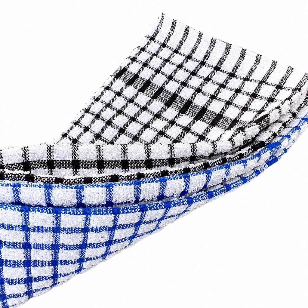 Close-up of black and white checkered fabric with blue and white checkered fabric on a white background