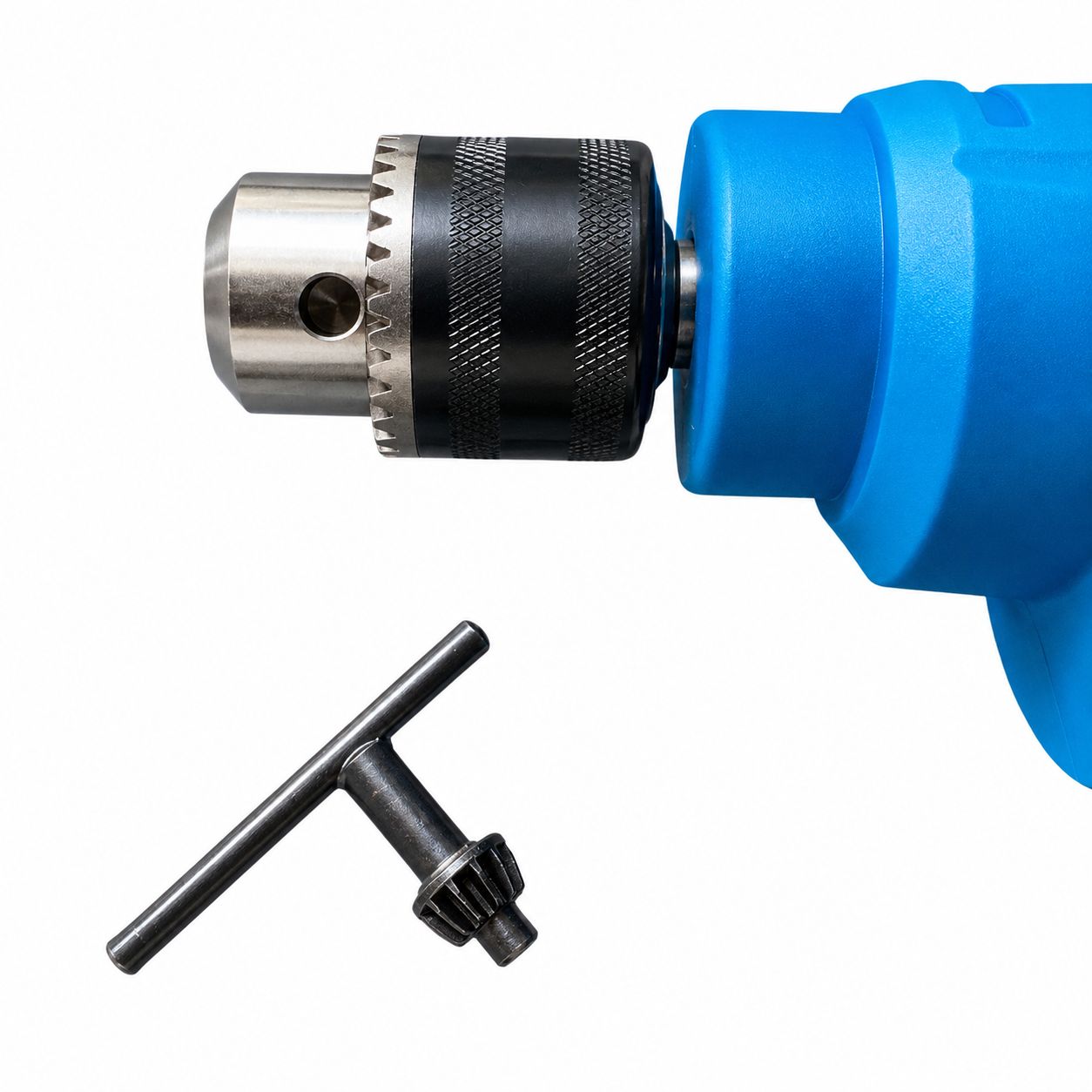 Blue drill with drill bit and T-shaped wrench on a white background