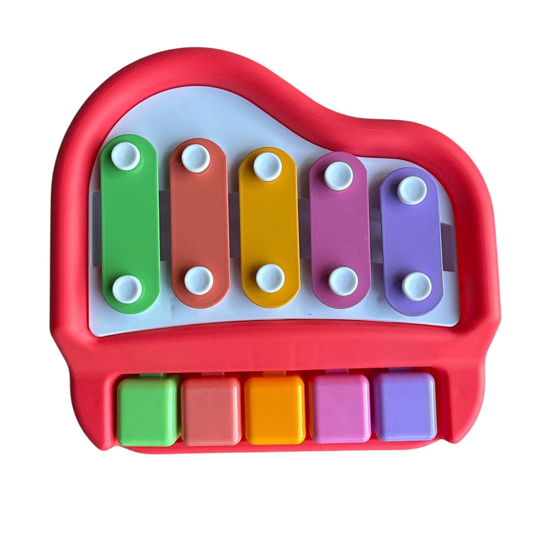 Colorful toy piano with red casing on a white background