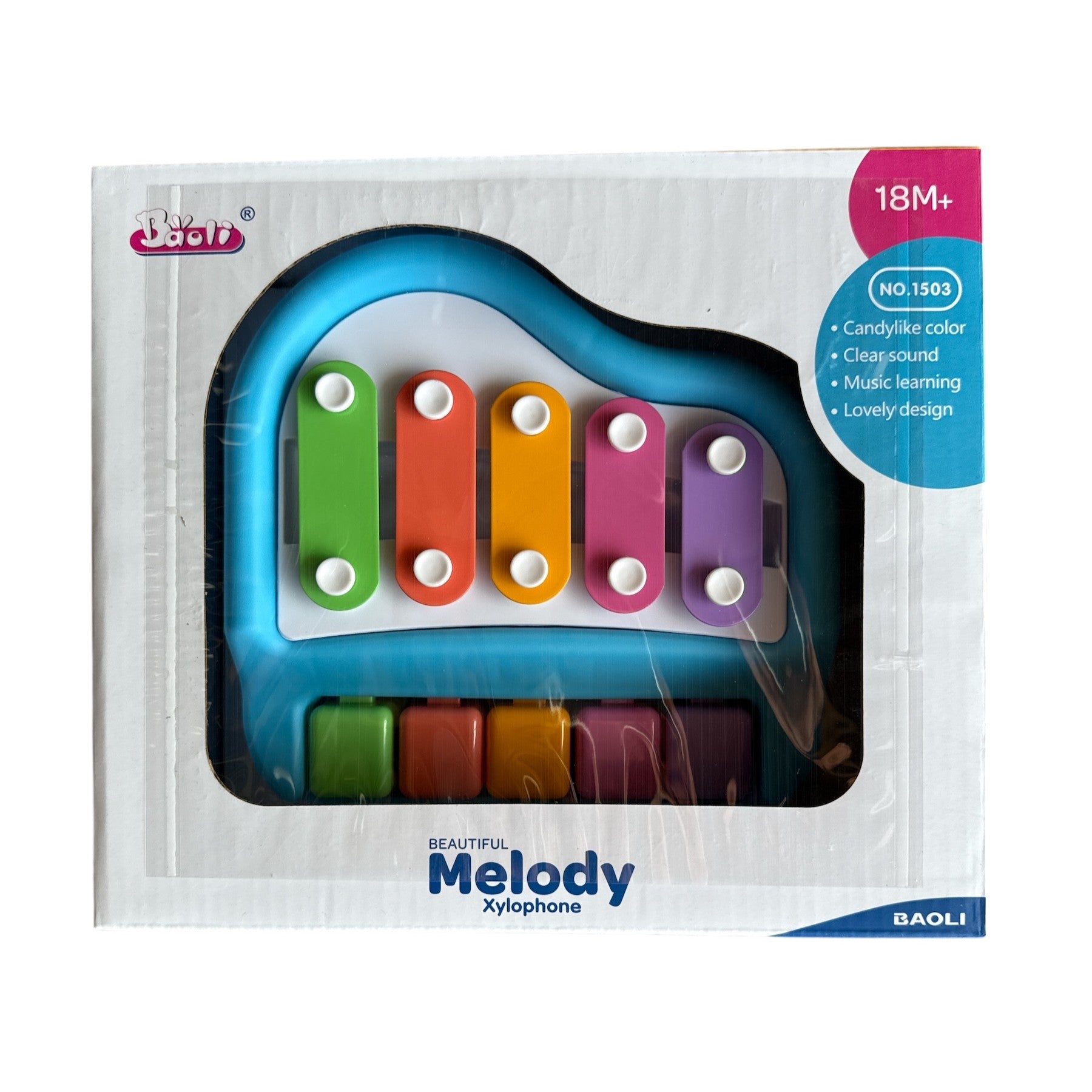 Colorful xylophone toy with transparent packaging on a white background