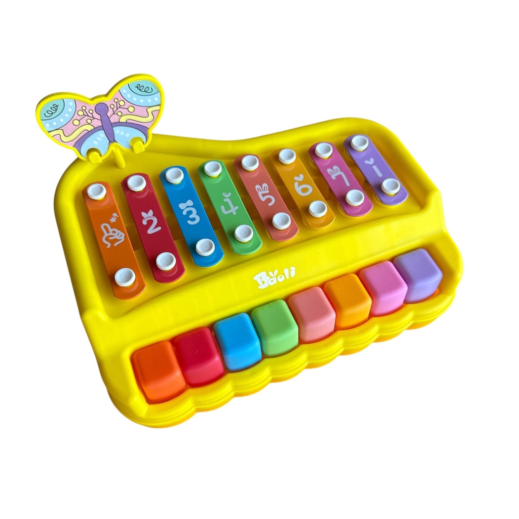 Colorful toy keyboard with xylophone keys on a white background