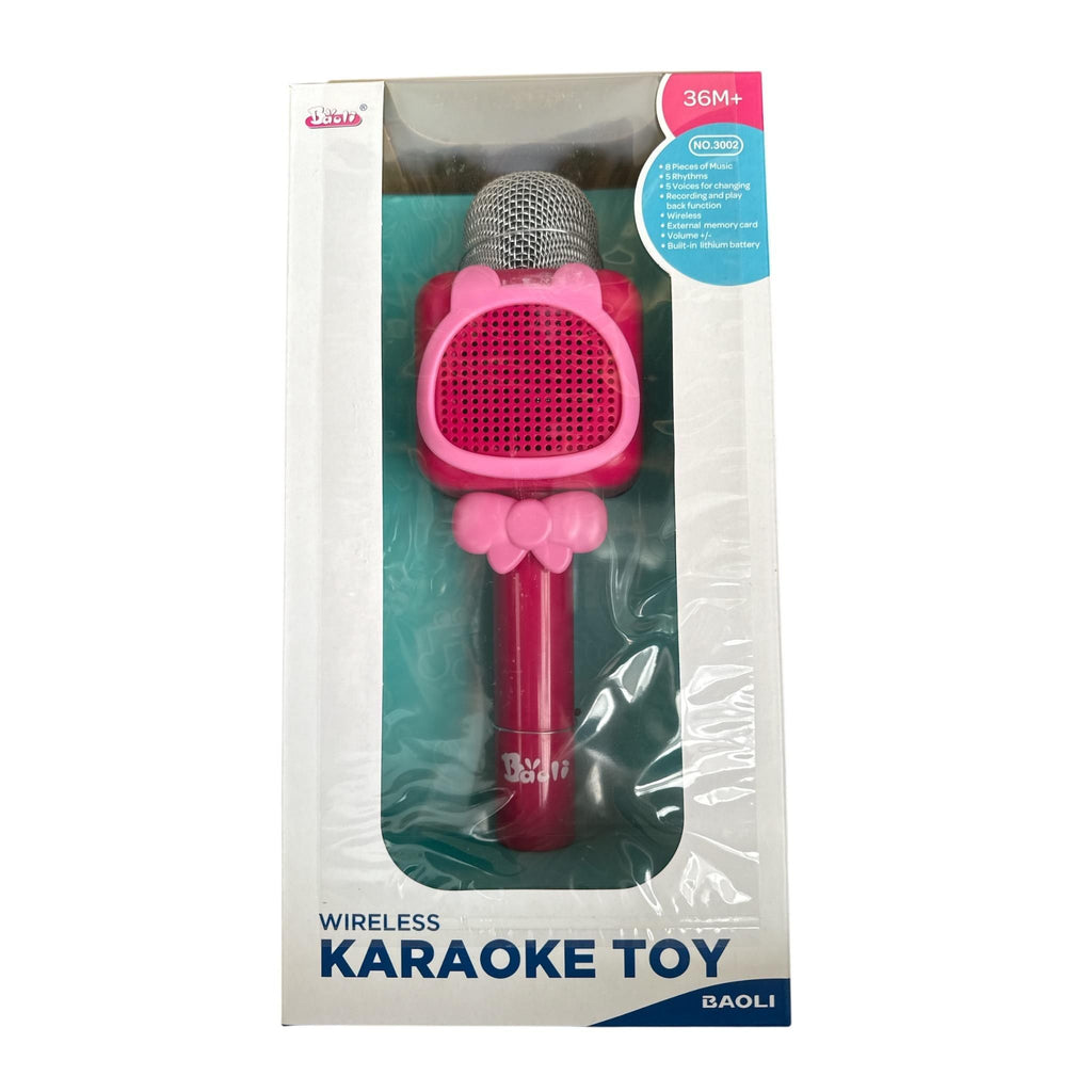 Pink toy microphone with bow in packaging on a white background