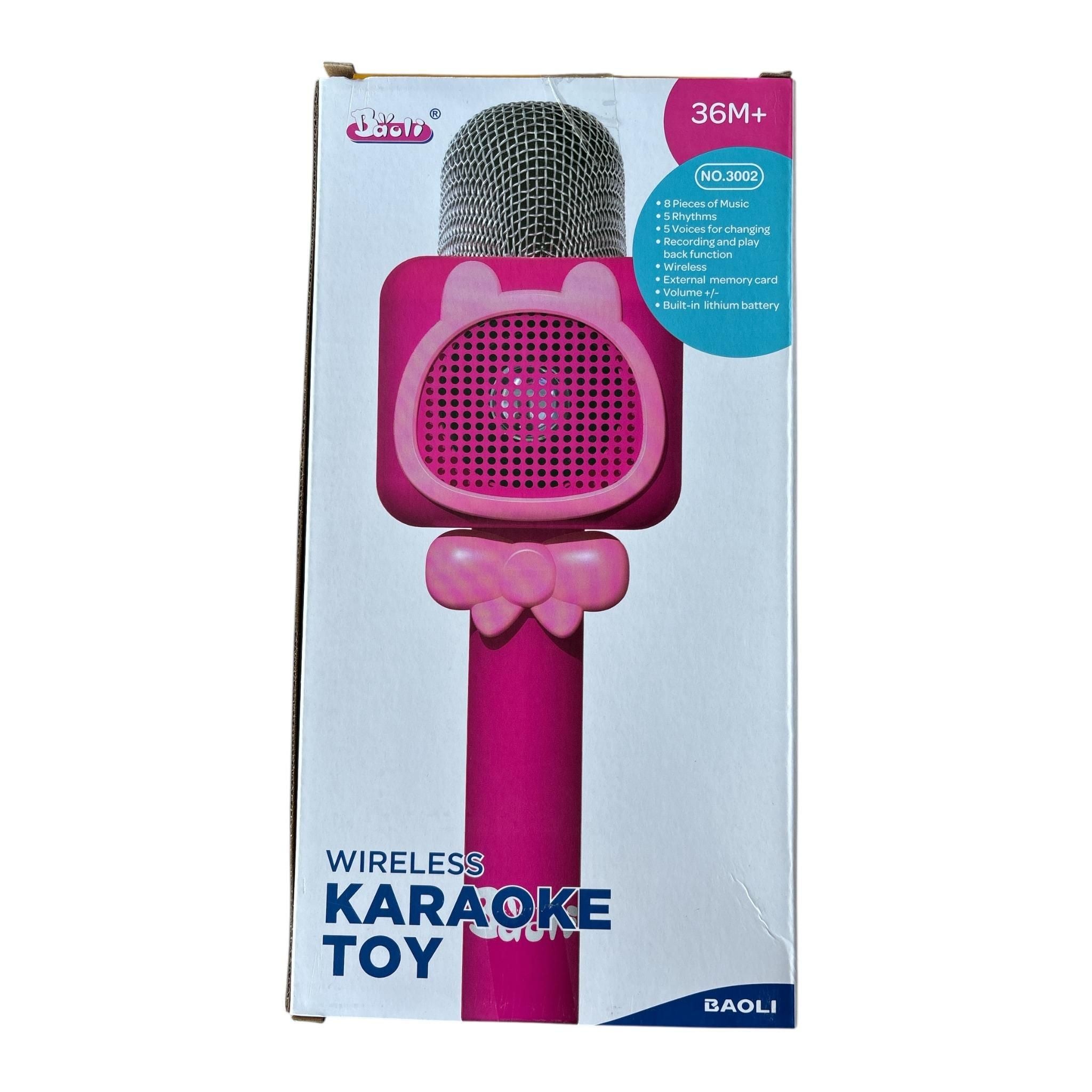 Pink toy microphone with packaging on a white background