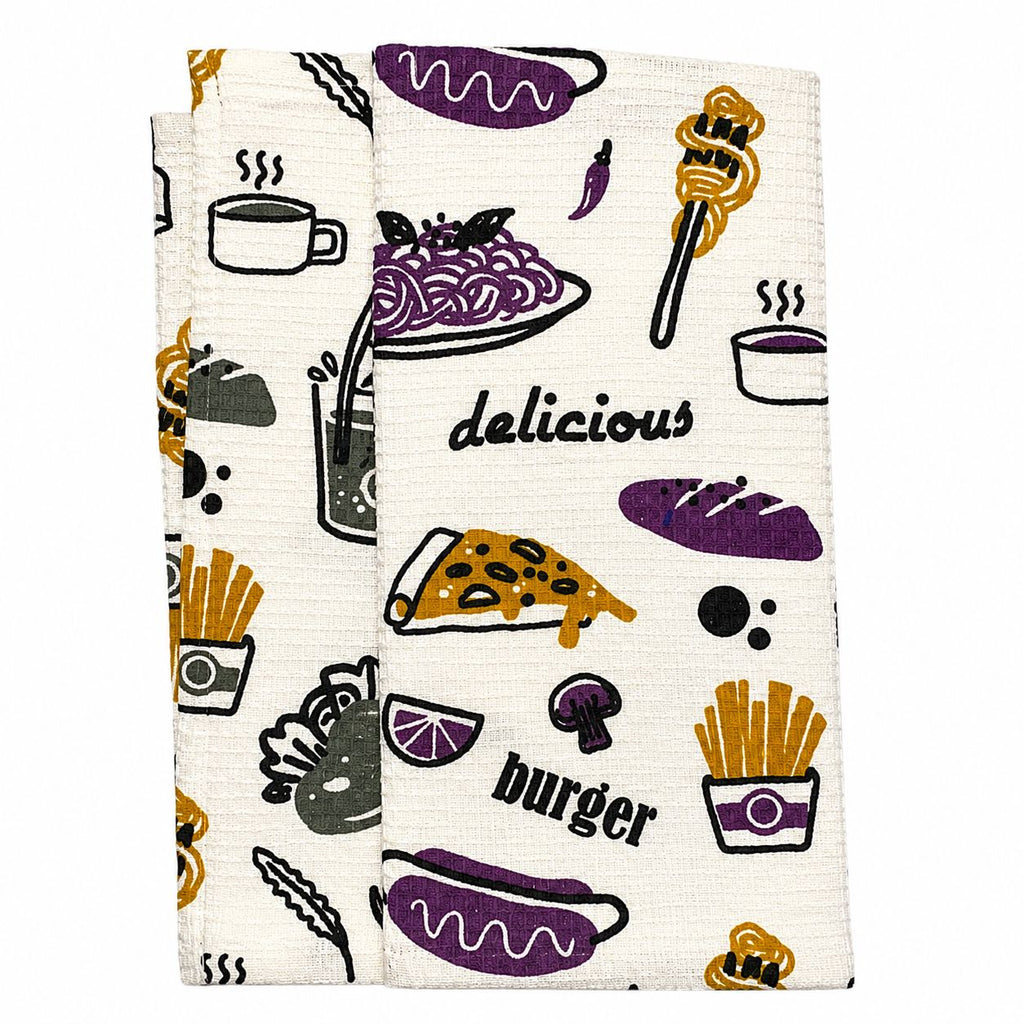 Two kitchen towels with food-themed designs on a white background