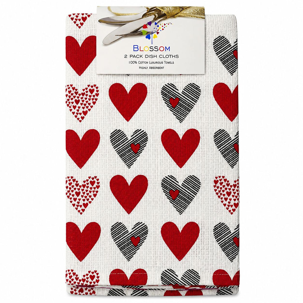 Pack of two dish cloths with heart patterns in red, black, and white, branded 'Blossom'.