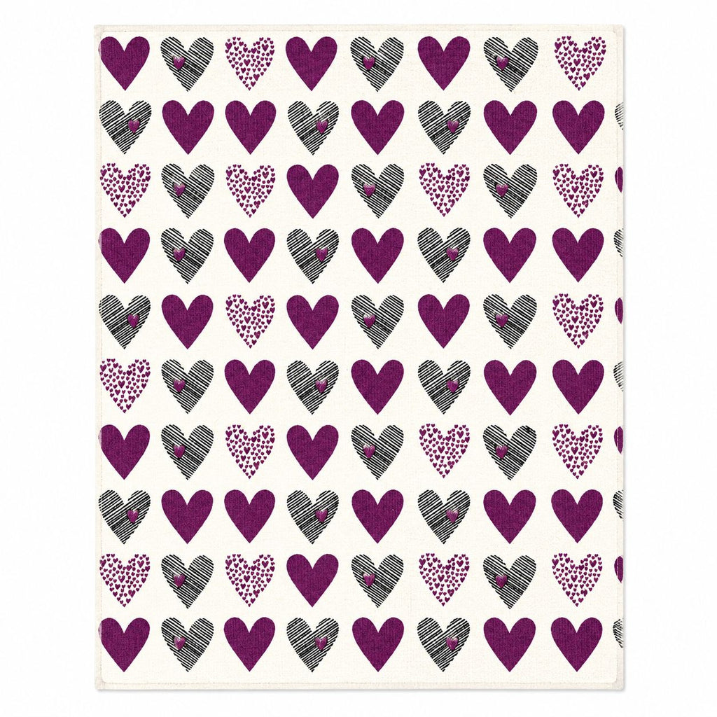 Pattern of purple hearts with black and gray accents on a white background