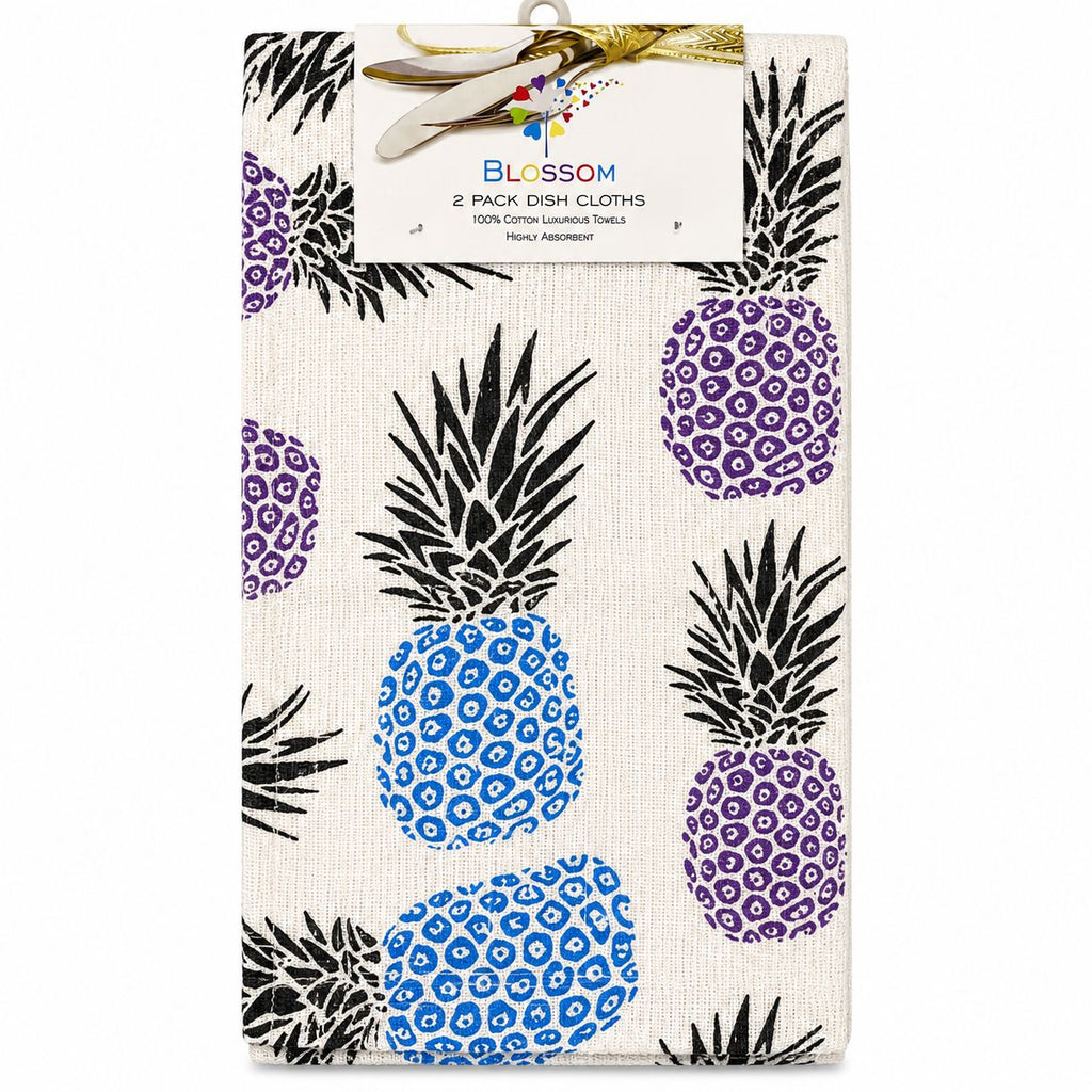 Pack of two dish cloths with pineapple pattern in packaging, brand 'Blossom' visible.
