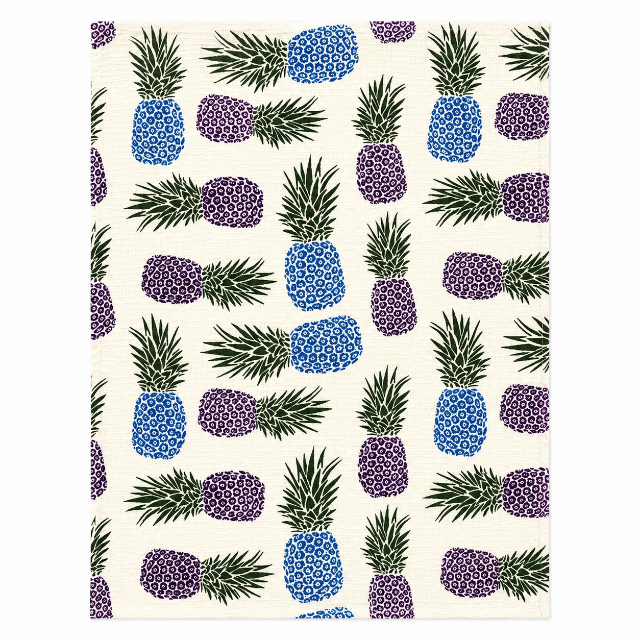 Patterned fabric with blue, purple, and green pineapple design on a white background