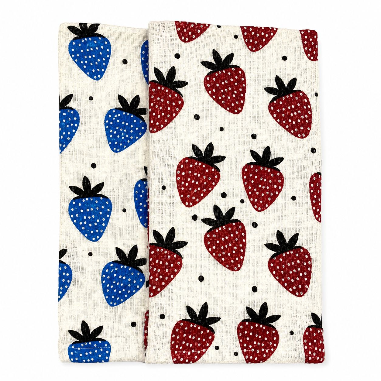 Two fabric swatches with strawberry patterns on a white background