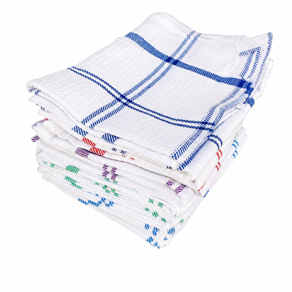 Stack of white kitchen towels with blue and red plaid patterns on a white background