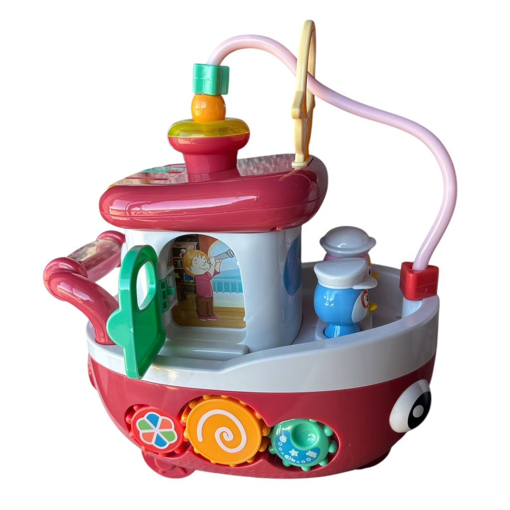 Colorful toy boat with various interactive elements on a white background