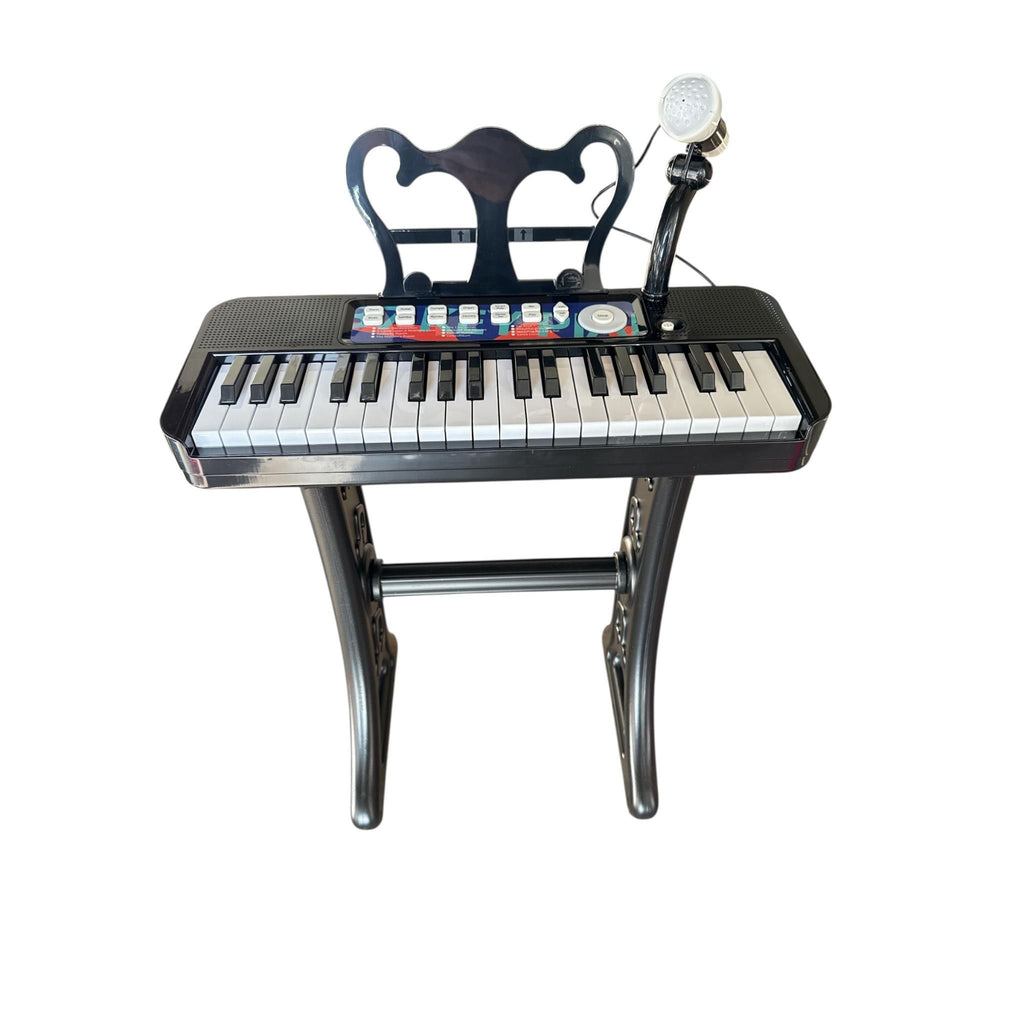 Children's keyboard with chair and microphone on a white background