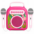 Pink portable speaker with microphone attachments on a white background