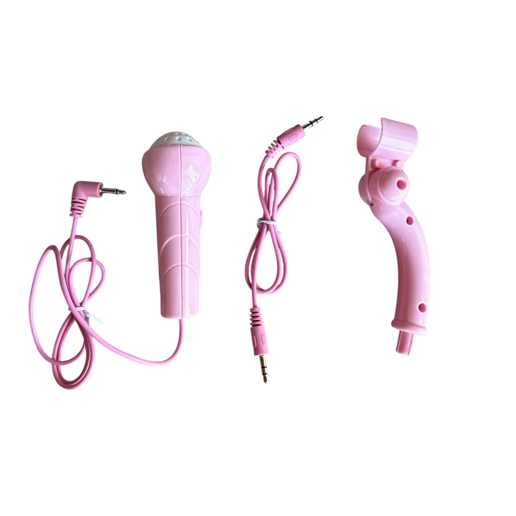 Pink microphone and handheld gaming controller on a white background