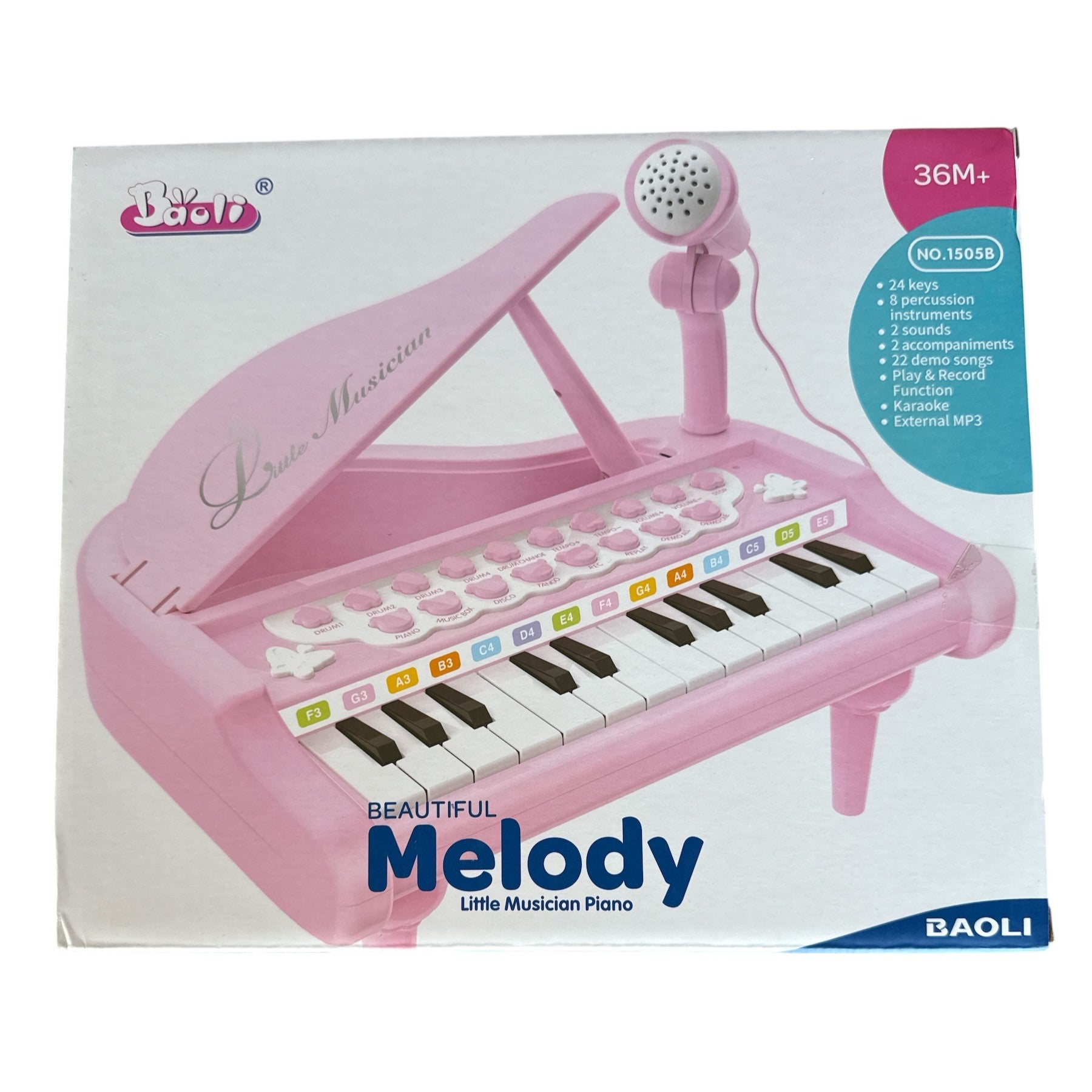 Pink toy piano with microphone on a white background