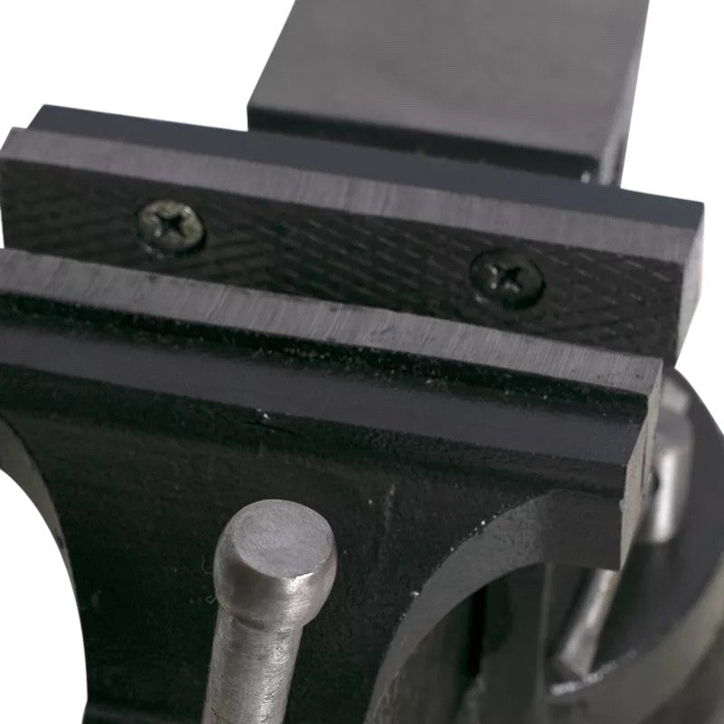 Close-up of a black metal vise with a white background