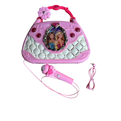 Pink toy handbag with microphone and strap on a white background