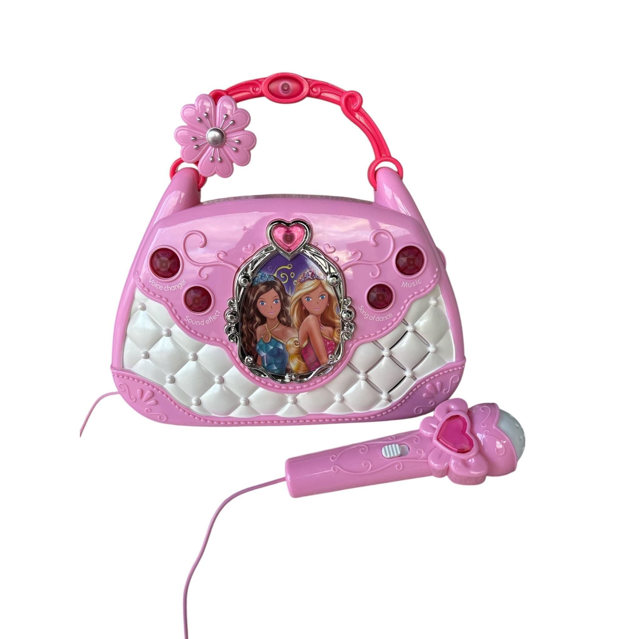 Pink toy radio with microphone on a white background