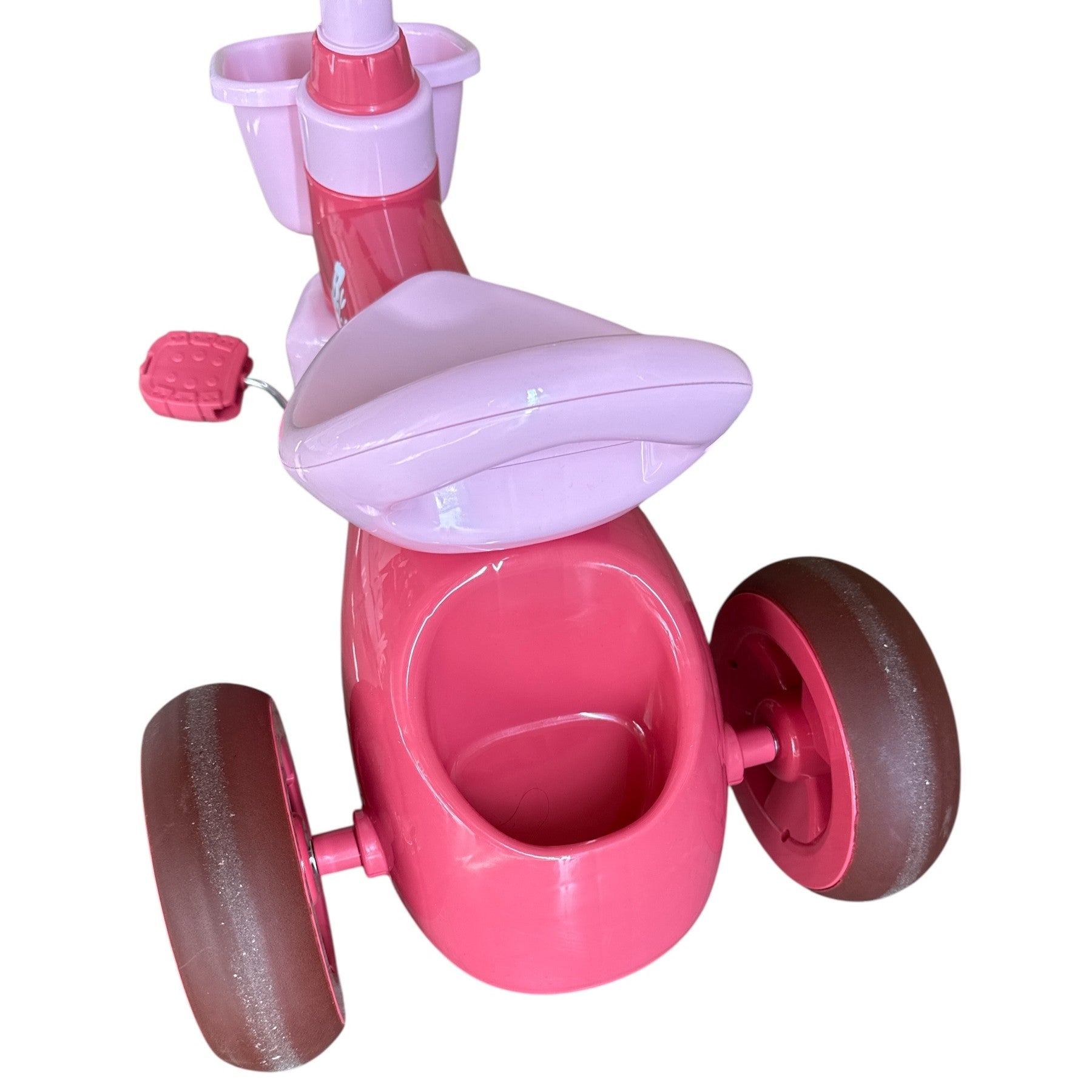 Pink and purple children's tricycle on a white background